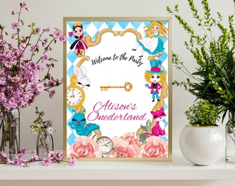 May include: A white welcome sign with a gold frame and a blue and white checkered background. The sign features characters from Alice in Wonderland, including the Queen of Hearts, Alice, the Mad Hatter, and the Cheshire Cat. The text on the sign reads "Welcome to the Party" and "Alison's Onederland".