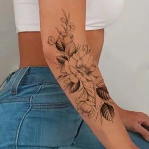 Floral wrap around piece by Delayney at Bed of Roses Tattoos in Tampa FL   rtattoos