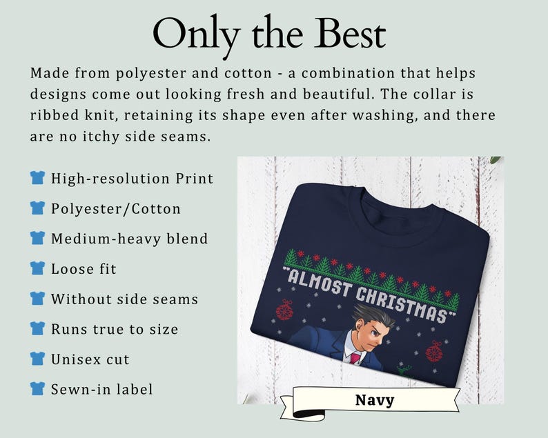 May include: A navy blue crewneck sweatshirt featuring a graphic print of a character in a suit with the text "ALMOST CHRISTMAS" above, surrounded by a pattern of green pine trees and red ornaments. The garment has a ribbed knit collar.