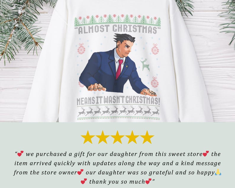 May include: A white long-sleeve sweatshirt featuring a graphic of a character in a blue suit and red tie. The text reads ALMOST CHRISTMAS MEANS IT WASN'T CHRISTMAS, surrounded by green and red holiday patterns including reindeer and ornaments.