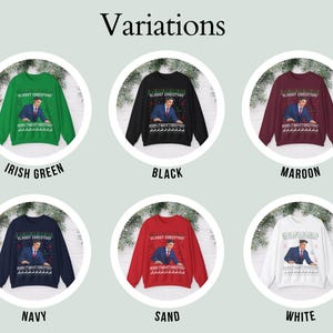 May include: Six long-sleeve crewneck sweatshirts in Irish green, black, maroon, navy, sand, and white. Each features a graphic of a person in a suit with the text ALMOST CHRISTMAS and a row of reindeer silhouettes along the bottom hem.