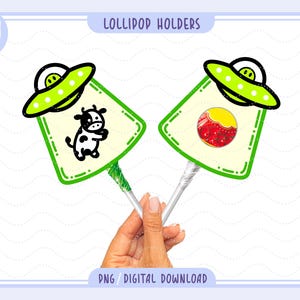 May include: Two lollipop holders with a green alien spaceship design. One holder features a black and white cow illustration, and the other has a red and yellow lollipop. The text "Lollipop Holders" and "PNG / DIGITAL DOWNLOAD" are visible.
