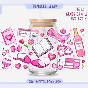 May include: A clear glass can wrap with a wooden lid, featuring pink illustrations of books, hearts, a high heel, a wine bottle, and other romantic elements. The text on the wrap says "Tumbler Wrap" and "16 oz Glass Can Wrap Size 9.75 x 5".