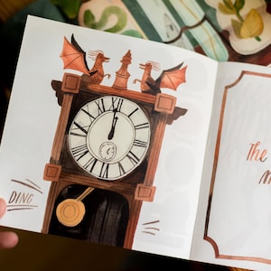 May include: A vintage-style clock with a wooden frame and a white face. Two red dragons with gold accents are perched on top of the clock. The clock face reads "The clock strikes midnight".