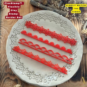 May include: A set of four red flexible clay stamp border designs. The stamps are arranged on a round, light gray surface with a floral pattern. The text "FlexStamp Flexible Clay Stamp-Border Set" is visible.