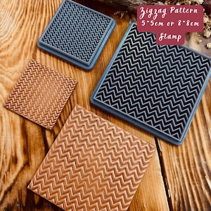 May include: Three silicone stamps with a zigzag pattern. The stamps are 5.5 cm or 8 cm square. The text "Zigzag Pattern 5.5cm or 8.8cm Stamp" is visible in the image.