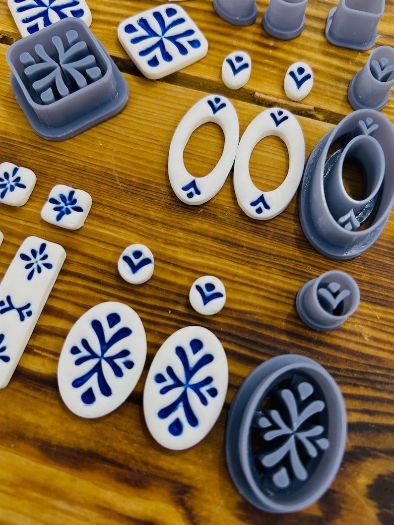 May include: A set of 10 polymer clay cutters in various shapes and sizes, including circles, ovals, and squares. The cutters are designed with a snowflake pattern and are perfect for creating decorative accents for crafts.