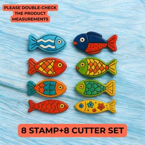 May include: A set of eight fish-shaped stamps and cutters in vibrant colours. The fish designs feature blue, red, orange, green, and yellow hues with intricate patterns. Text at the top says "PLEASE DOUBLE-CHECK THE PRODUCT MEASUREMENTS" and at the bottom "8 STAMP+8 CUTTER SET".