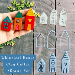 May include: A set of whimsical house clay cutters and stamp set. The image shows colorful clay houses in red, orange, and green, alongside blue plastic cutters and stamped house shapes. The text reads "Whimsical House Clay Cutter + Stamp Set."