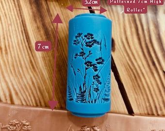 May include: A blue rolling pin with a floral pattern, measuring 7 inches tall and 32 inches long. "Mini Flower Meadow Patterned 7cm High Roller"
