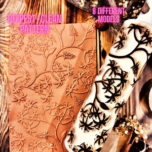 May include: A close-up of a wooden rolling pin with a floral design. The rolling pin is next to a clay mold with the same design. The text "DEEPEST + CLEAN PATTERN" is visible on the mold. The text "8 DIFFERENT MODELS" is visible on the wooden background.