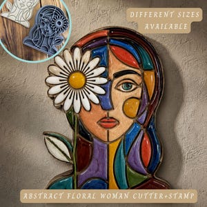 May include: An abstract floral woman cutter and stamp. The artwork depicts a woman's face with a daisy covering one eye. The face is divided into colourful geometric shapes. The text "Different Sizes Available" and "Abstract Floral Woman Cutter+Stamp" are visible.