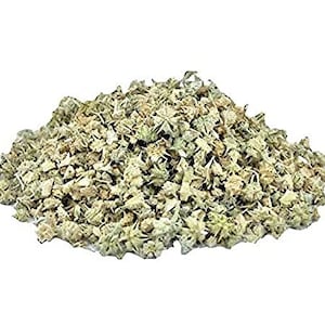May include: Dried, light green and brown herb with a rough texture. The herb is in a pile and appears to be loose leaf.