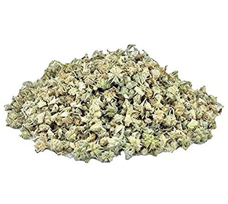 May include: Dried, light green and brown herb with a rough texture. The herb is in a pile and appears to be loose leaf.