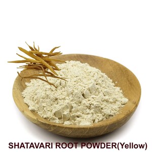 May include: A wooden bowl filled with light beige Shatavari root powder. A few dried Shatavari root pieces are visible on the side of the bowl.  SHATAVARI ROOT POWDER(Yellow)