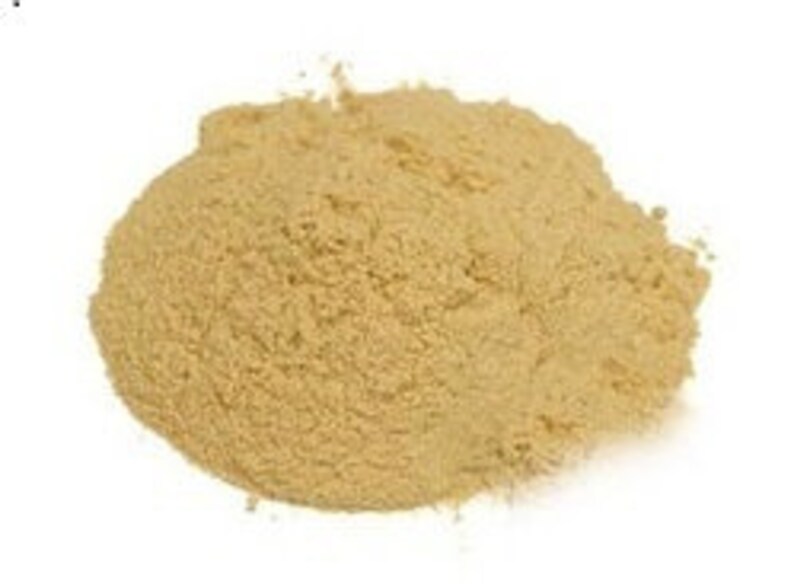May include: A close-up of a pile of light brown powder. The powder is fine and uniform in texture.