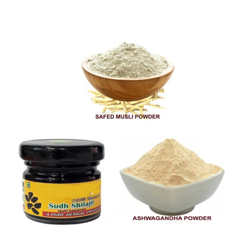 May include: Three containers of herbal powders: a brown bowl with white powder labeled "Safed Musli Powder", a white bowl with beige powder labeled "Ashwagandha Powder", and a small glass jar with dark liquid labeled "Sudh Shilajit A Pure Herbal Product".