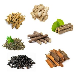 May include: A collection of dried herbs and spices, including ginger, liquorice root, cinnamon sticks, black peppercorns, and dried green tea leaves.