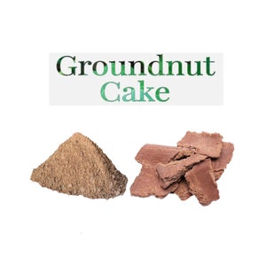 May include: Groundnut Cake, a brown powder and a pile of brown, broken pieces of cake.