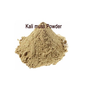May include: A pile of light brown Kali musli powder.