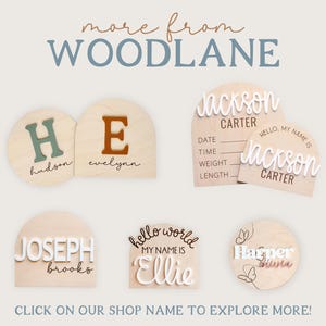 May include: A collection of wooden signs featuring arched and circular shapes with personalized names and birth details. The signs include raised white, green, and orange lettering, script fonts, and butterfly line art designs.