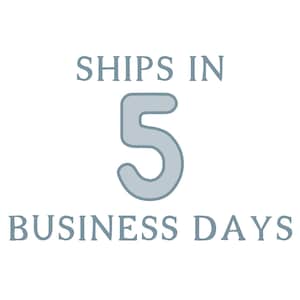 May include: A graphic design featuring the text SHIPS IN in a light blue serif font, followed by a large, centered light blue number 5 with rounded edges, and the text BUSINESS DAYS in the same light blue serif font positioned below the number.