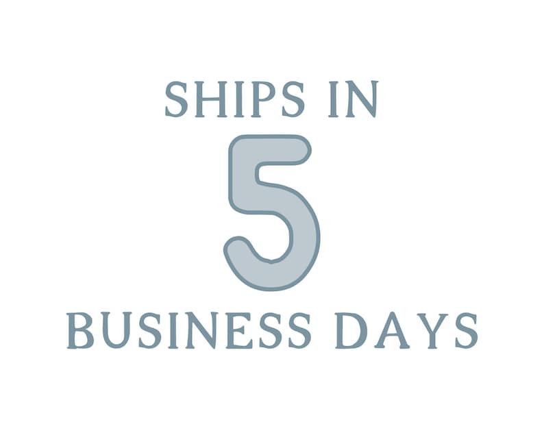 May include: A graphic design featuring the text SHIPS IN in a light blue serif font, followed by a large, centered light blue number 5 with rounded edges, and the text BUSINESS DAYS in the same light blue serif font positioned below the number.