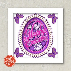 Puede incluir: Una obra de arte enmarcada con temática de Pascua que presenta un diseño de huevo en capas con las palabras "Happy Easter" en una vibrante escritura rosa. El huevo está rodeado de patrones florales morados y blancos y cuatro mariposas moradas con acentos amarillos.