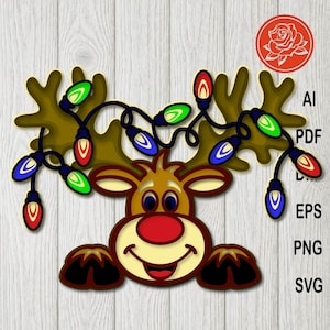 May include: A cartoon reindeer with brown antlers and a red nose, smiling with a string of colourful Christmas lights. The image includes the text "AI, PDF, EPS, PNG, SVG" in a vertical list.