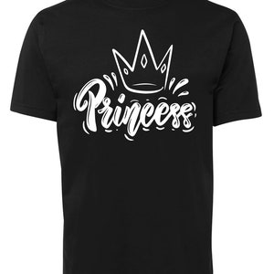 May include: Black t-shirt with a white crown and the word "Princess" in a stylized font.
