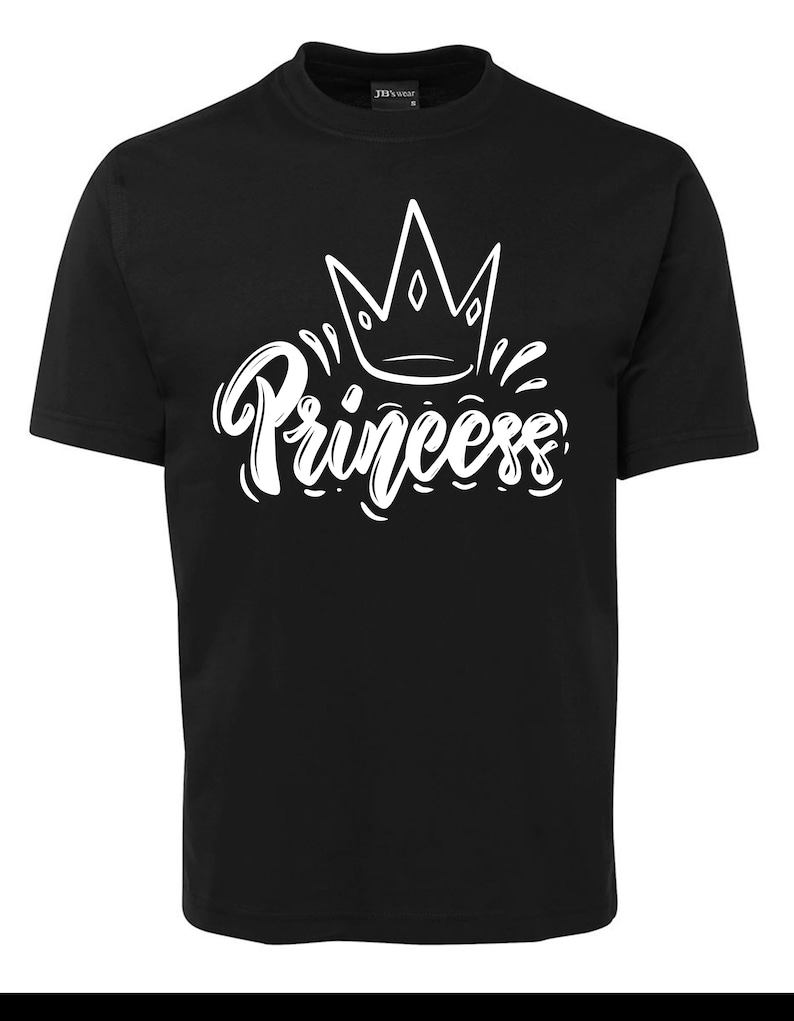 May include: Black t-shirt with a white crown and the word "Princess" in a stylized font.