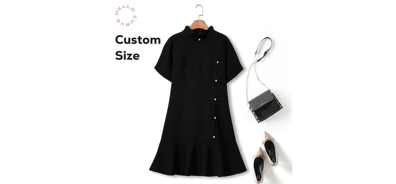 May include: A black short-sleeved dress with a button-up front and a ruffled hem. The dress has a collar and is styled with a black purse and nude heels.