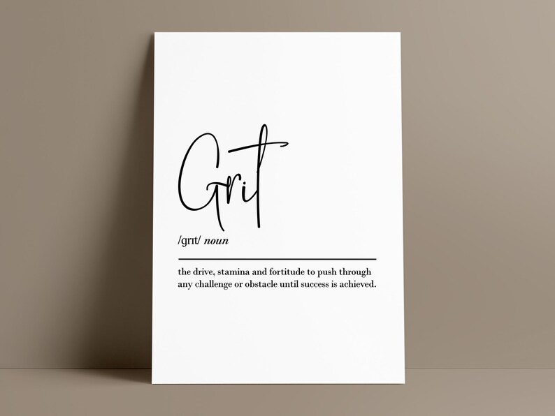 May include: A white poster with the word "Grit" in a stylish black script font. Below the word is the definition of grit, which is the drive, stamina, and fortitude to push through any challenge or obstacle until success is achieved.