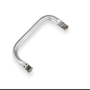 May include: Silver metal handle with a curved shape and two sets of small metal prongs at each end.