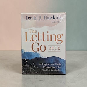 May include: A deck of cards titled "The Letting Go Deck" by David R. Hawkins, M.D., Ph.D. The box features watercolor-style artwork in shades of blue and gold. The text on the box reads "44 Inspirational Cards to Experience the Power of Surrender."