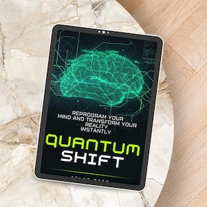 May include: A digital tablet displays a green brain graphic with the words "Quantum Shift." The text "Reprogram Your Mind and Transform Your Reality Instantly" is also visible. The tablet is on a marble-like surface.
