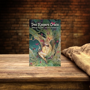 May include: A Tree Keepers Oracle card deck featuring a fantasy illustration of a woman with tree-like hair and a glowing orb. The cover art is set against a backdrop of a wooden table and a brick wall.