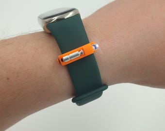 LIXY NANO: la linterna micro nano más pequeña del mundo para pulseras, brazaletes y gafas inteligentes en color naranja.