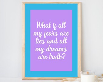 May include: A rectangular wall art print in a light wood frame featuring a bright blue border surrounding a lavender center. The text in white cursive font reads: What if all my fears are lies and all my dreams are truth? The print is displayed upright.