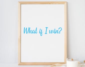 May include: A light wood frame containing a white print with the blue text "What if I win?" and the black text "| printable digital download |" positioned above the frame. The frame is displayed with a white candle and dried stems.