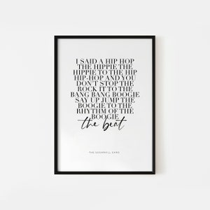 May include: Black and white printable wall art featuring lyrics from the song "Rapper's Delight" by The Sugarhill Gang. The lyrics read: "I said a hip hop, the hippie, the hippie to the hip hip-hop and you don't stop the rock it to the bang bang boogie say up jump the boogie to the rhythm of the boogie the beat".