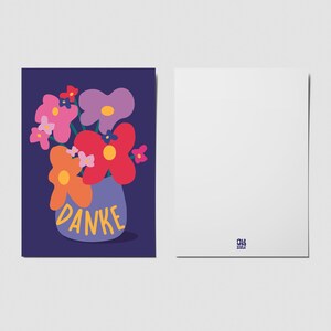 May include: A rectangular greeting card featuring a dark blue background with a stylized illustration of a purple vase containing colorful flowers in shades of pink, red, orange, and lavender. The word DANKE is printed in yellow on the vase.
