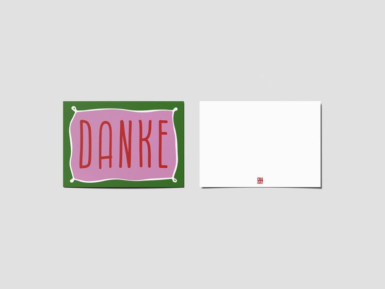 Peut inclure: Une carte rectangulaire avec une bordure verte et un centre rose portant le mot DANKE &eacute;crit en lettres rouges. &Agrave; c&ocirc;t&eacute; se trouve une carte blanche unie avec un petit logo rouge au centre en bas. Les deux cartes sont sur un fond neutre.
