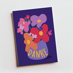 May include: A rectangular greeting card with a dark purple background featuring a stylized illustration of a bouquet of colorful flowers in a light purple vase. The word DANKE is printed in yellow capital letters on the front of the vase.