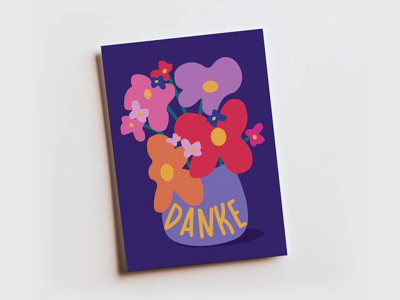 May include: A rectangular greeting card with a dark purple background featuring a stylized illustration of a bouquet of colorful flowers in a light purple vase. The word DANKE is printed in yellow capital letters on the front of the vase.