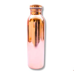 May include: A copper water bottle with a shiny, reflective surface. The bottle has a rounded base and a screw-on cap. The copper color transitions from a warm orange to a soft pink near the bottom. The bottle is designed for hydration.