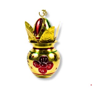 May include: A gold-colored, ornate pot with red and green accents and a floral design. The pot is topped with a red and green egg-shaped ornament and gold leaf-like decorations. A gold Om symbol sits atop the ornament.