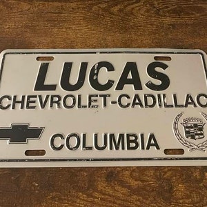 Lucas Chevrolet Cadillac Dealership Booster License Plate Columbia South Carolina Dealer
