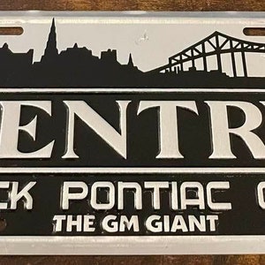 Sentry Buick Pontiac GMC Booster License Plate Dealership The GM Giant Charleston South Carolina Vintage Bridge