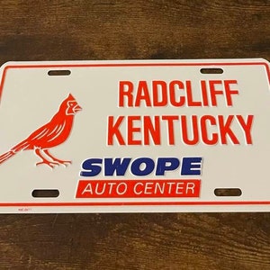 Radcliff Kentucky Swope Auto Center Booster Matrícula cardinal cardinals vintage dealer